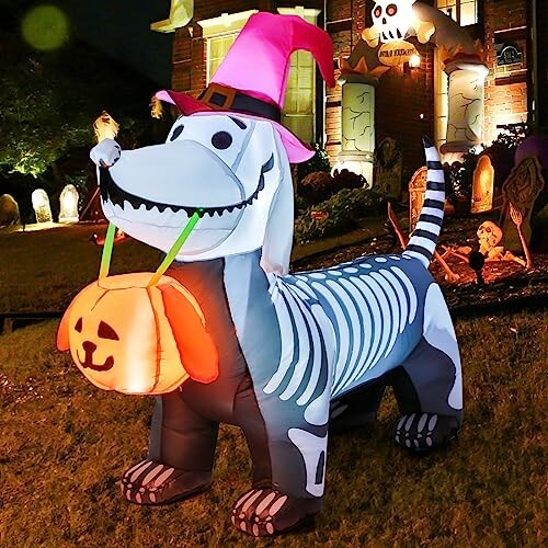 Inflatable Halloween dog with skeleton design and pink witch hat.