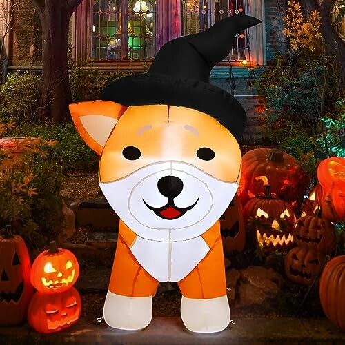 Inflatable dog in witch hat among Halloween pumpkins.