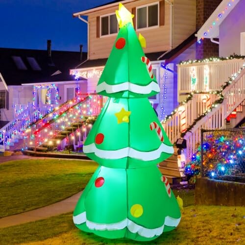Inflatable Christmas tree with lights in front of decorated houses
