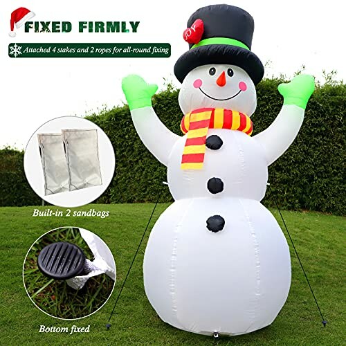 Inflatable snowman with stakes and sandbags for fixing.