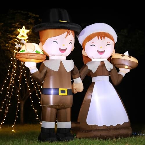 Inflatable Thanksgiving couple decoration with pies and lights.